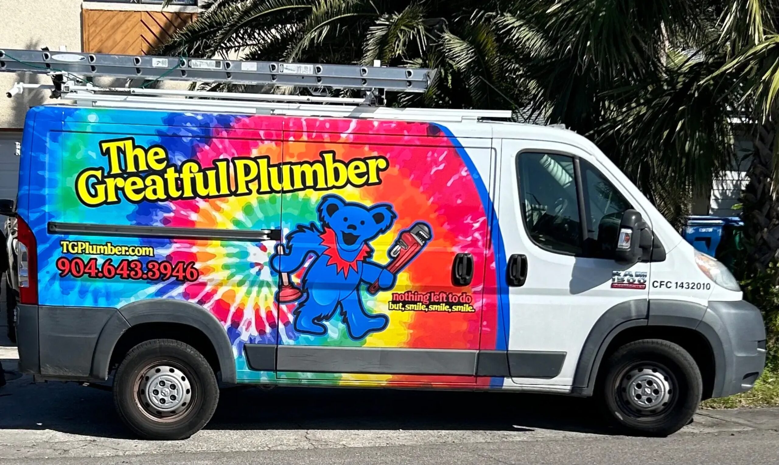 The Greatful Plumber van parked outside a home