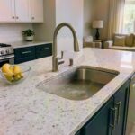 Clogged kitchen sink in a Jacksonville home with standing water backed up