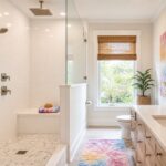 Modern Jacksonville bathroom renovation with a walk-in shower, subway tile, brushed nickel fixtures, and tie-dye inspired accents