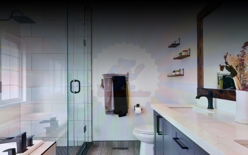 Modern renovated bathroom featuring glass shower doors, floating vanity with quartz countertop, and contemporary tile work - example of quality bathroom renovation in Jacksonville